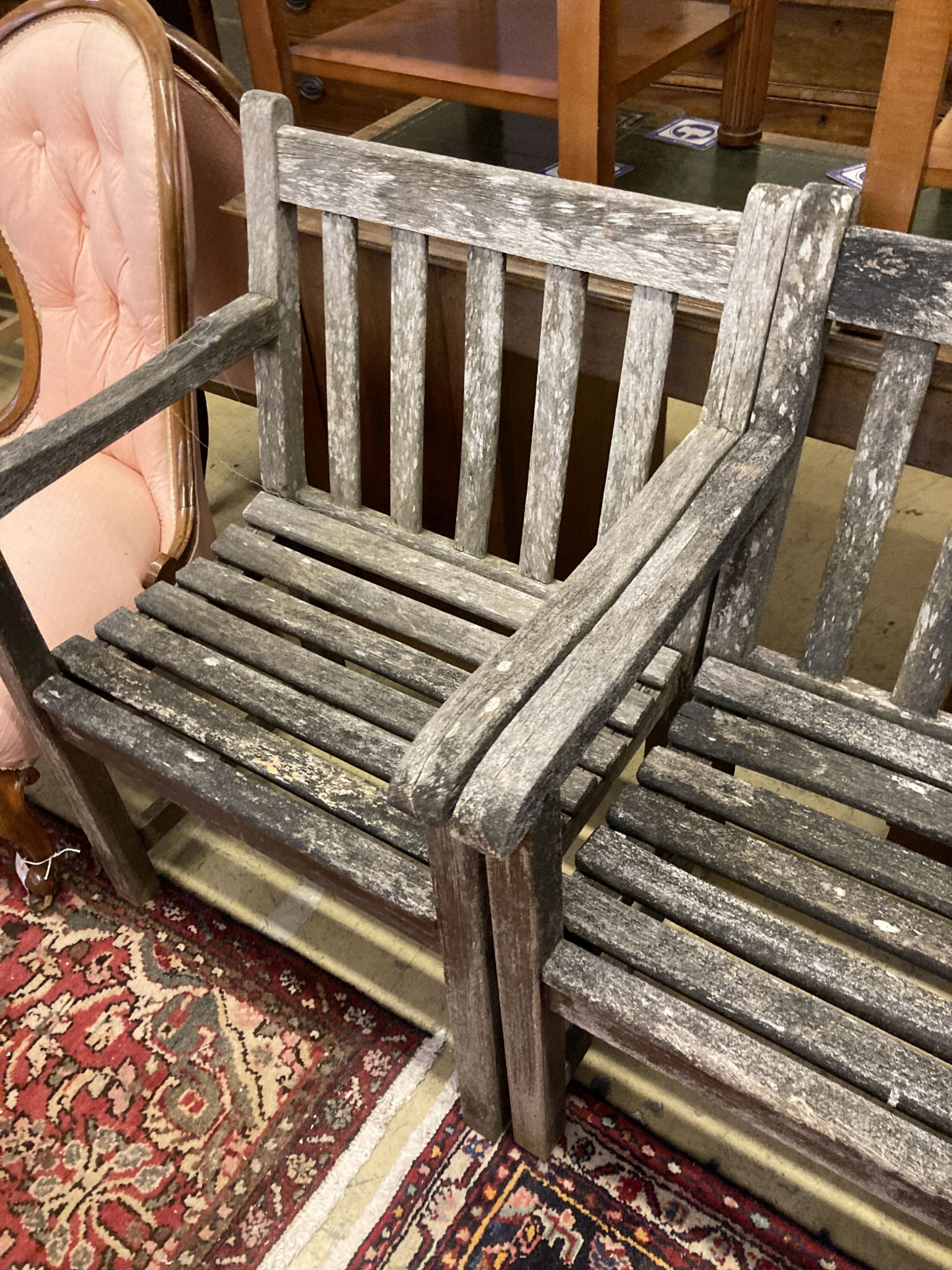 A set of six weathered teak elbow chairs, width 62cm, depth 58cm, height 85cm